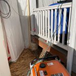 An indoor room with asbestos remediation materials.